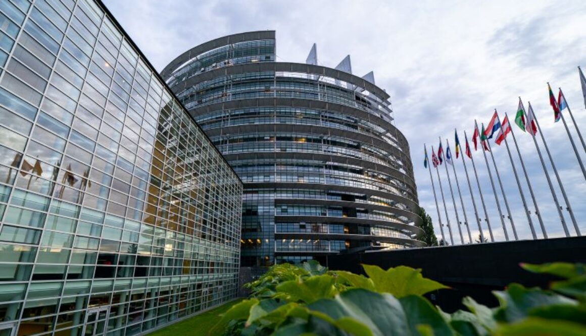 European Commission headquarters in Brussels with flags of European Union member states