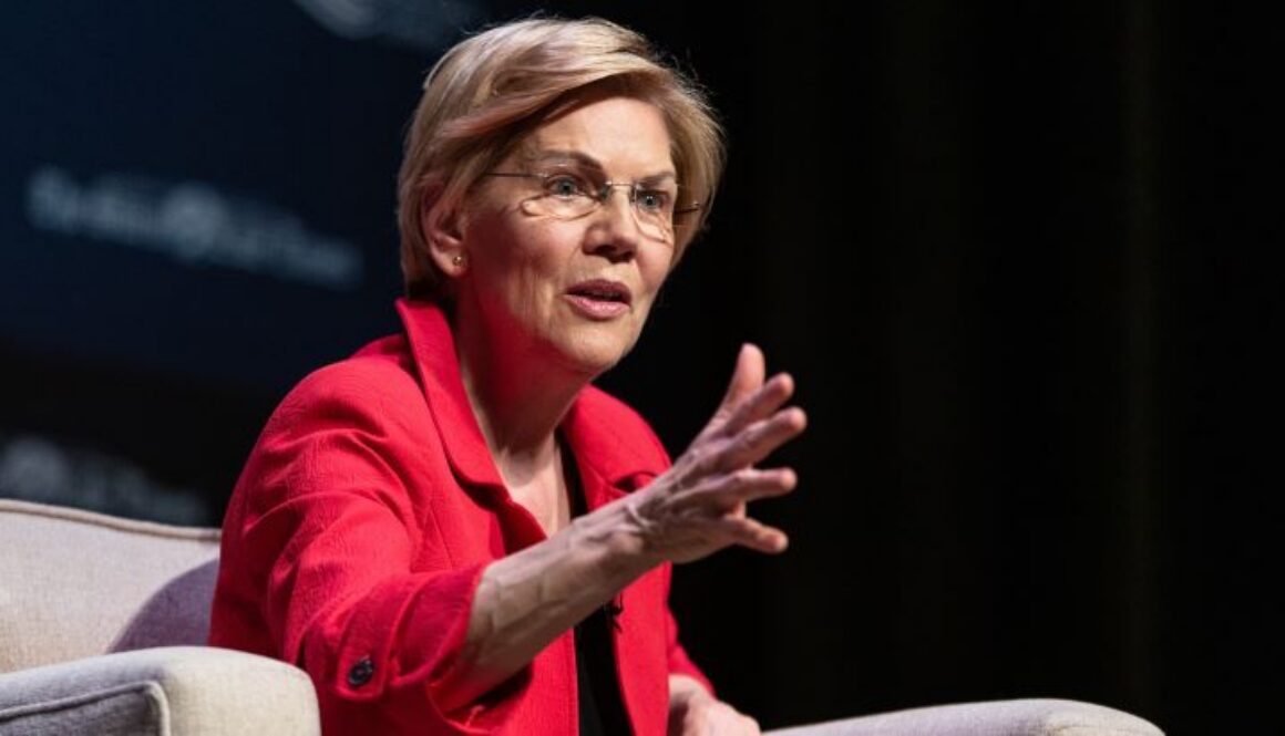 Senator Elizabeth Warren (D-Mass.) speaking at a public event, who introduced Senate Resolution 598 condemning the export of advanced AI chips to the United Arab Emirates