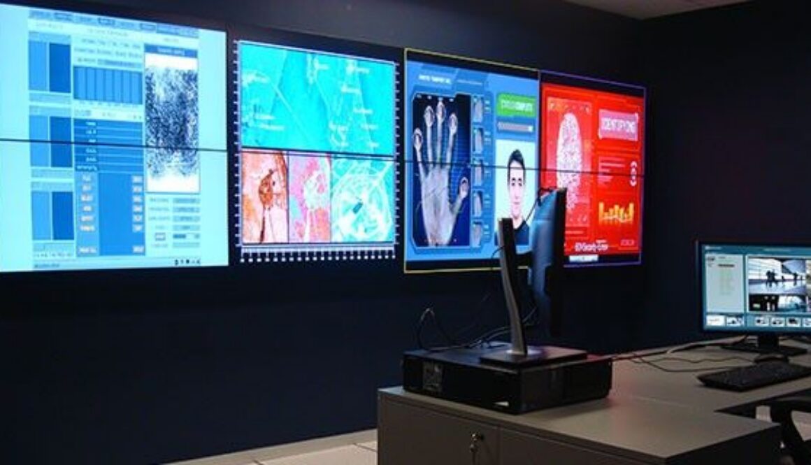 Security operations center displaying multiple digital dashboards and monitoring screens related to network activity
