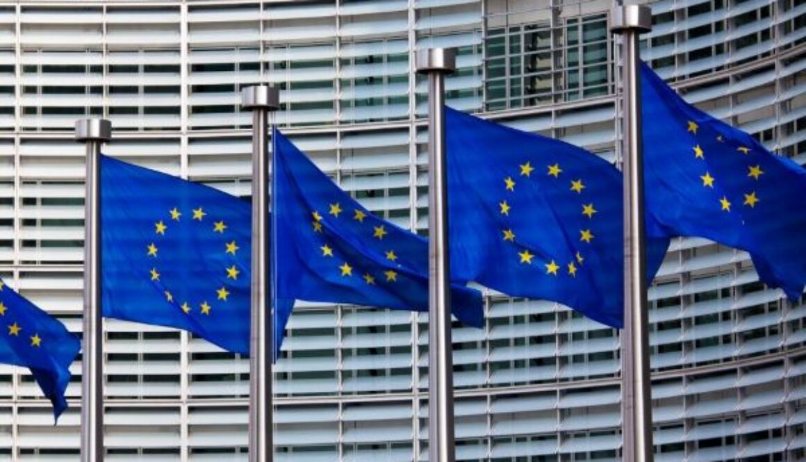 European Union flags displayed outside an EU institutional building in Brussels