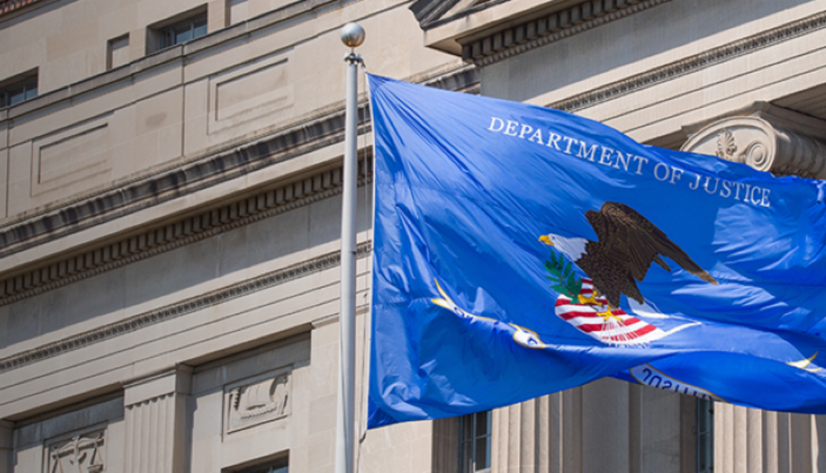 Department of Justice flag outside federal building representing DOJ involvement in xAI lawsuit over Colorado AI law