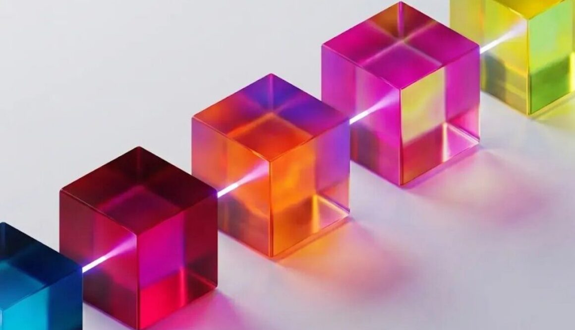 Five translucent colorful glass cubes arranged diagonally on a white surface, illustrating Google DeepMind multi-agent AI safety research.