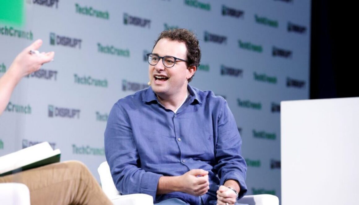 Anthropic CEO Dario Amodei speaking onstage at TechCrunch Disrupt 2023.
