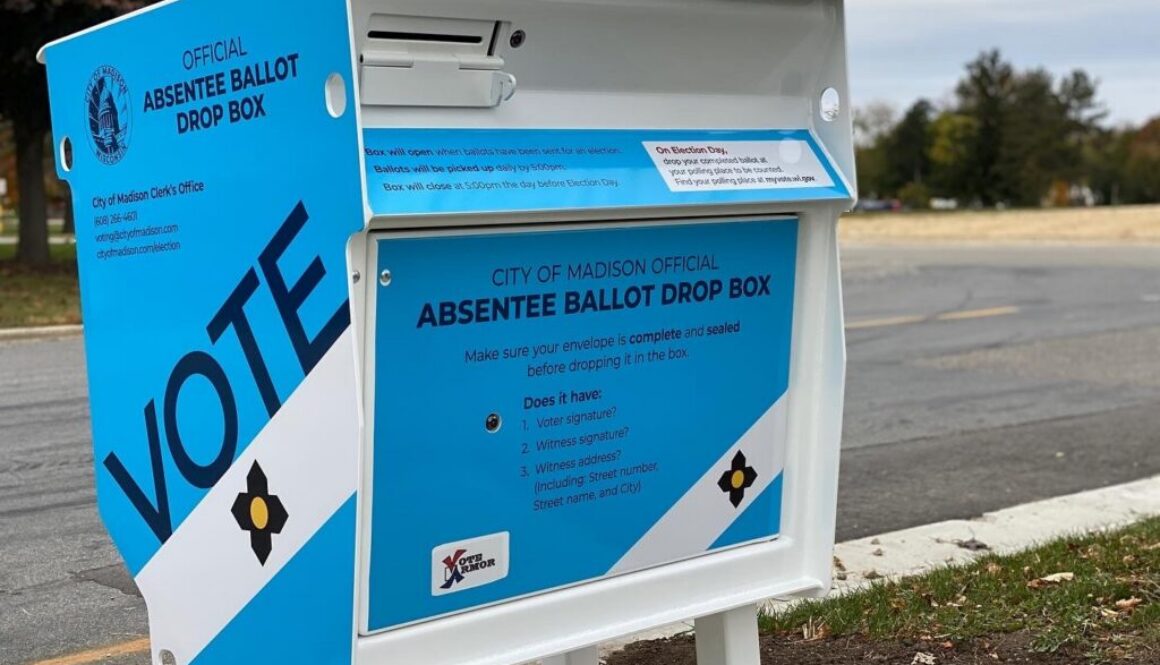 Blue absentee ballot drop box illustrating proposed disclosure rules for AI political ads.