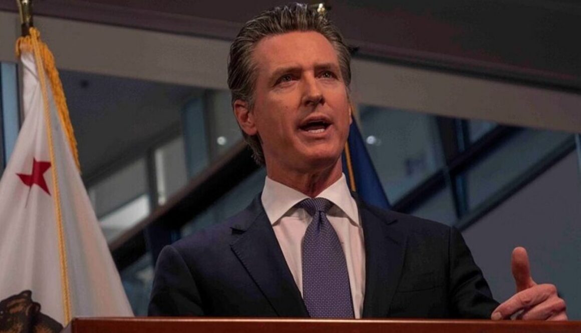 Gov. Gavin Newsom speaks at a lectern for an article about California’s AI cyber defense program.