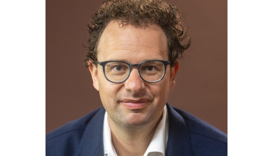 A portrait of Anthropic CEO Dario Amodei, on his call for leading AI companies to slow frontier AI development