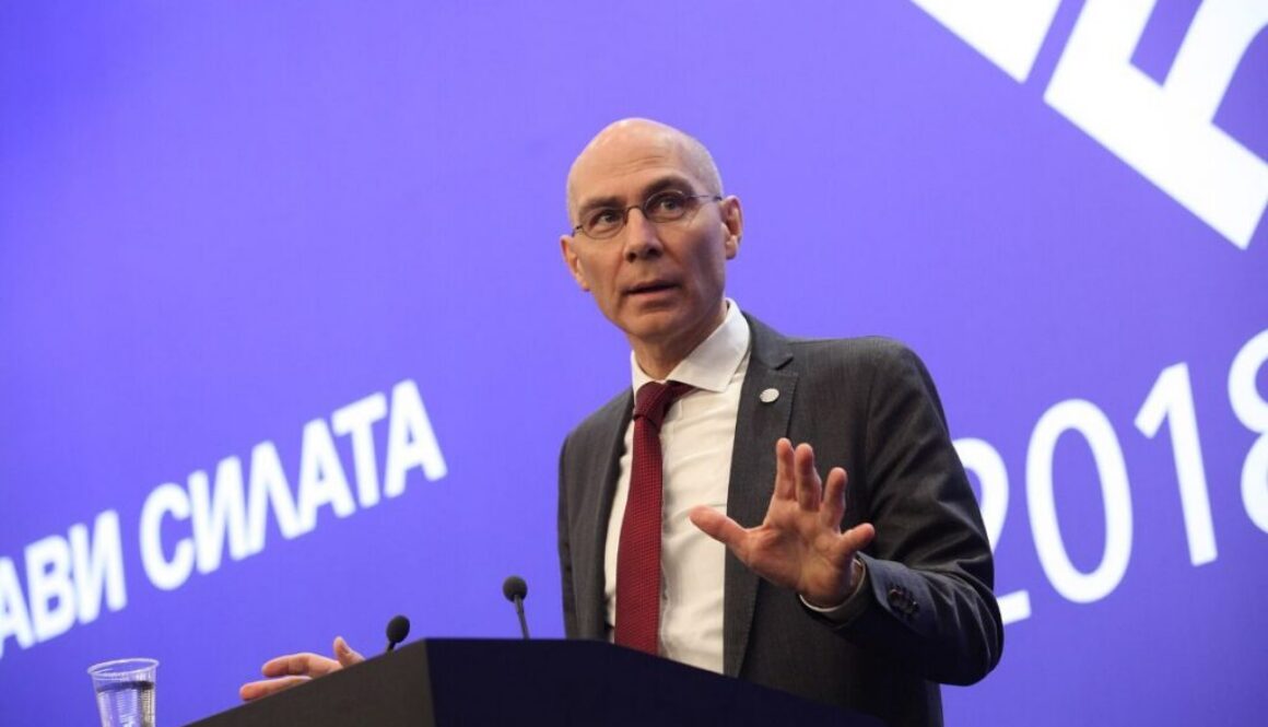 Volker Türk gestures while speaking at a lectern, on his warning that advanced AI could become an existential risk