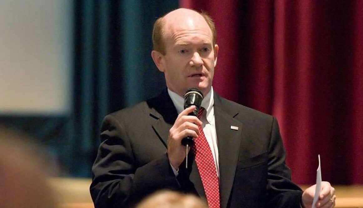 Sen. Chris Coons speaks at a 2013 town hall. He and three senators introduced the AI Systems Transparency Act in 2026.
