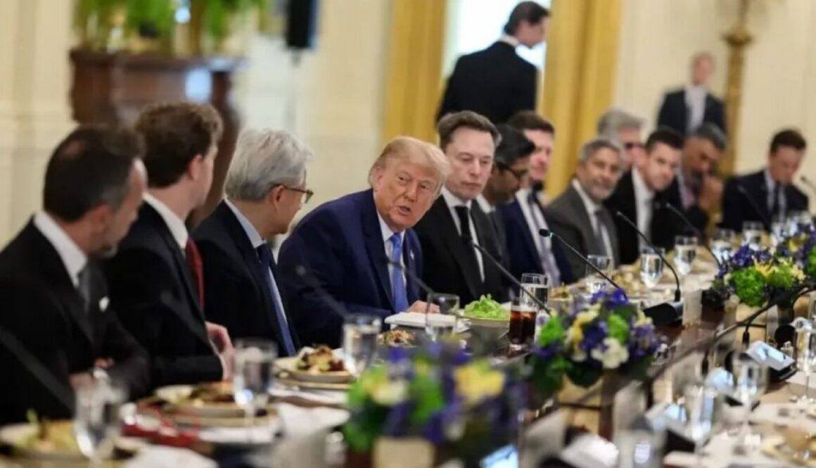 Donald Trump seated with tech leaders at a long White House dining table, for a story on the White House safety accord